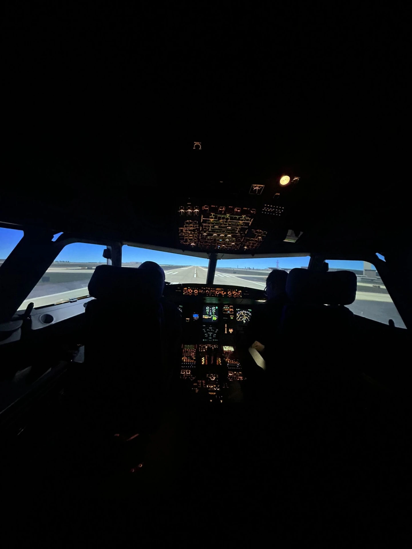 A tall view from the simulator cockpit of the runway ahead